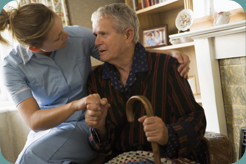 A caregiver comforting an elderly client